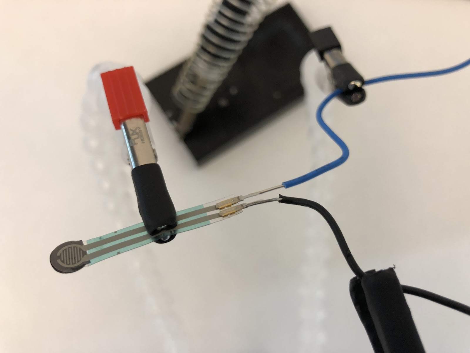 Using the Helping Hands to solder wires to the force sensor