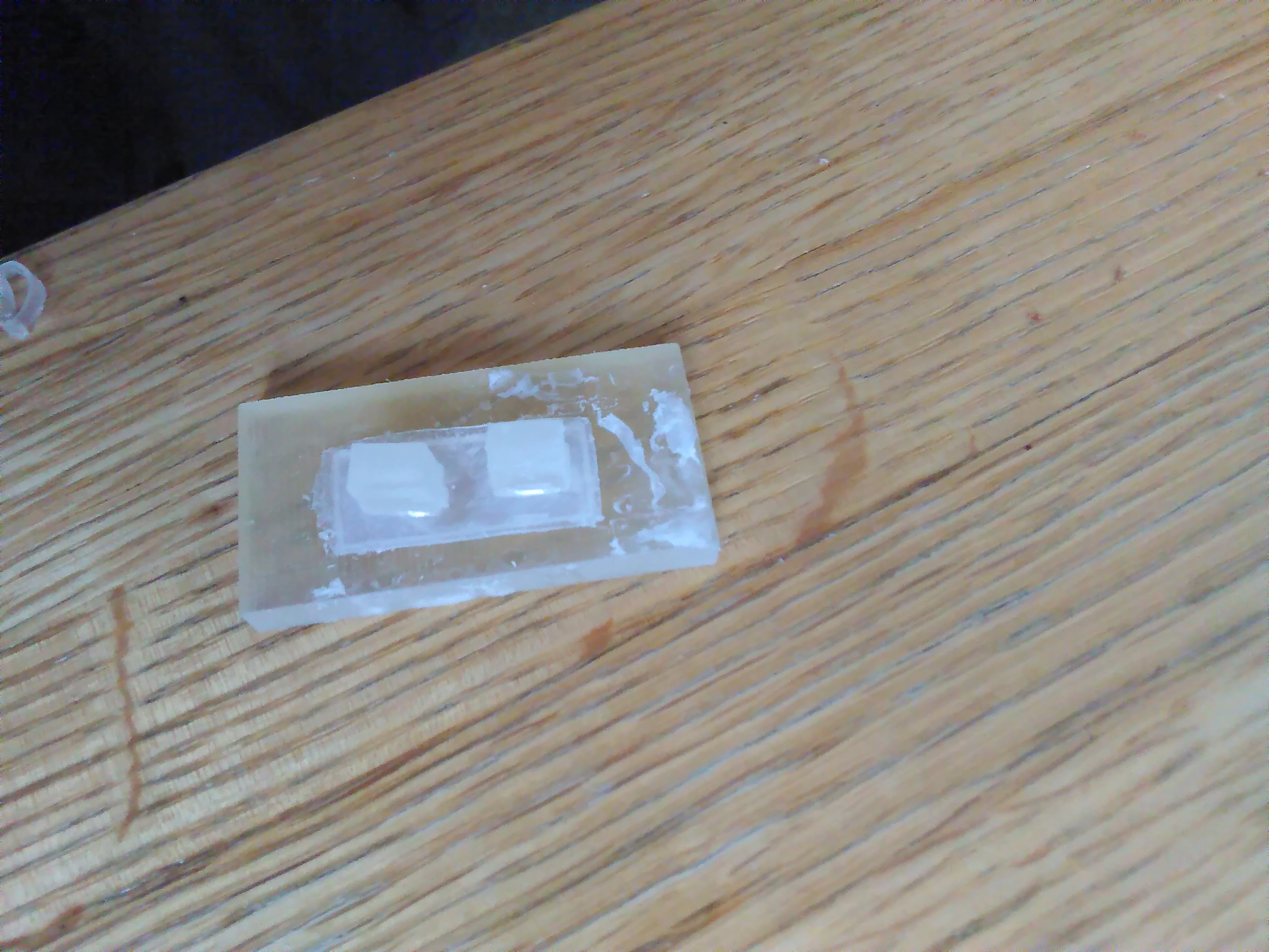 Strut embedded into silicone and mould.