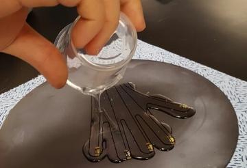 Pouring PDMS over printed conductive material
