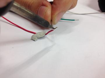 Apply solder to first wire