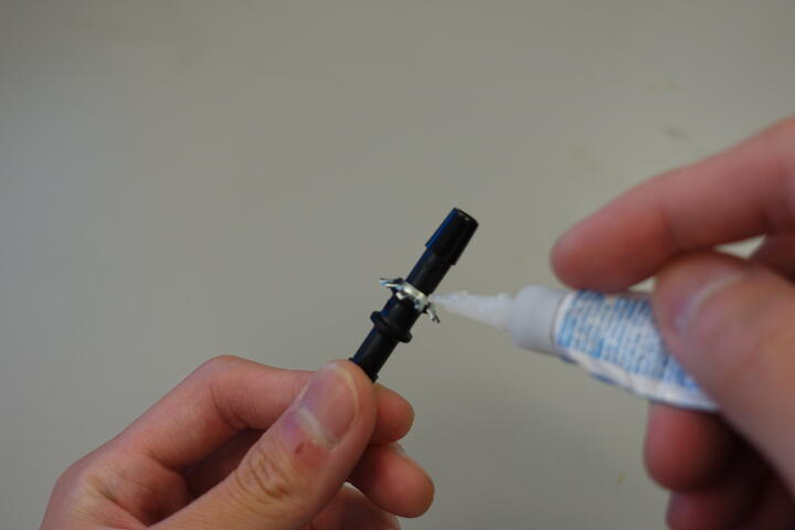 Applying super glue to tube connector